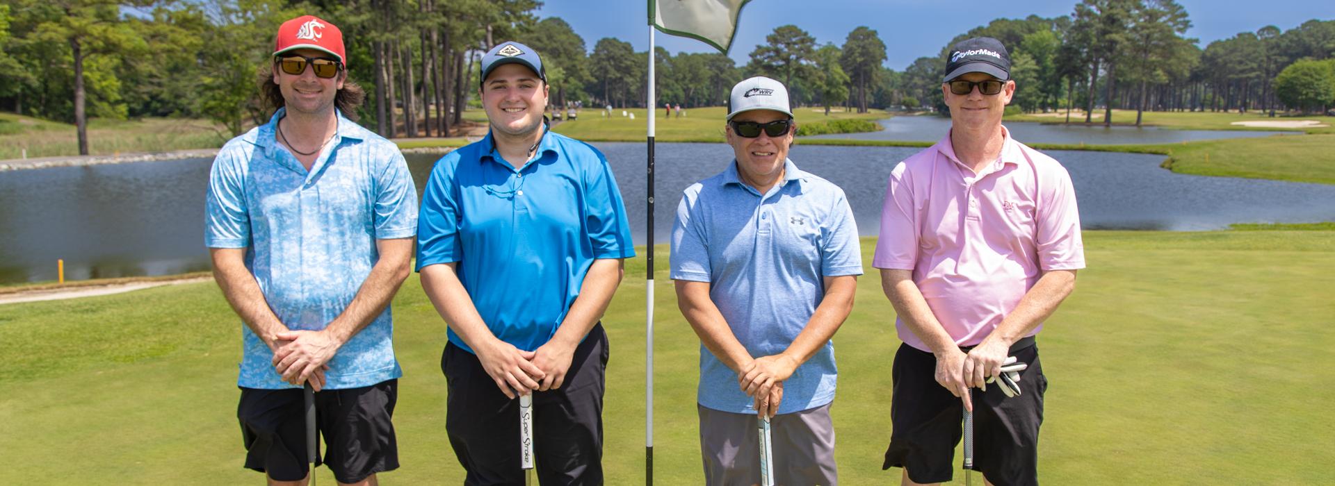 4-man golf team outside on a golf course at the YMCA Charity Golf Classic 2025