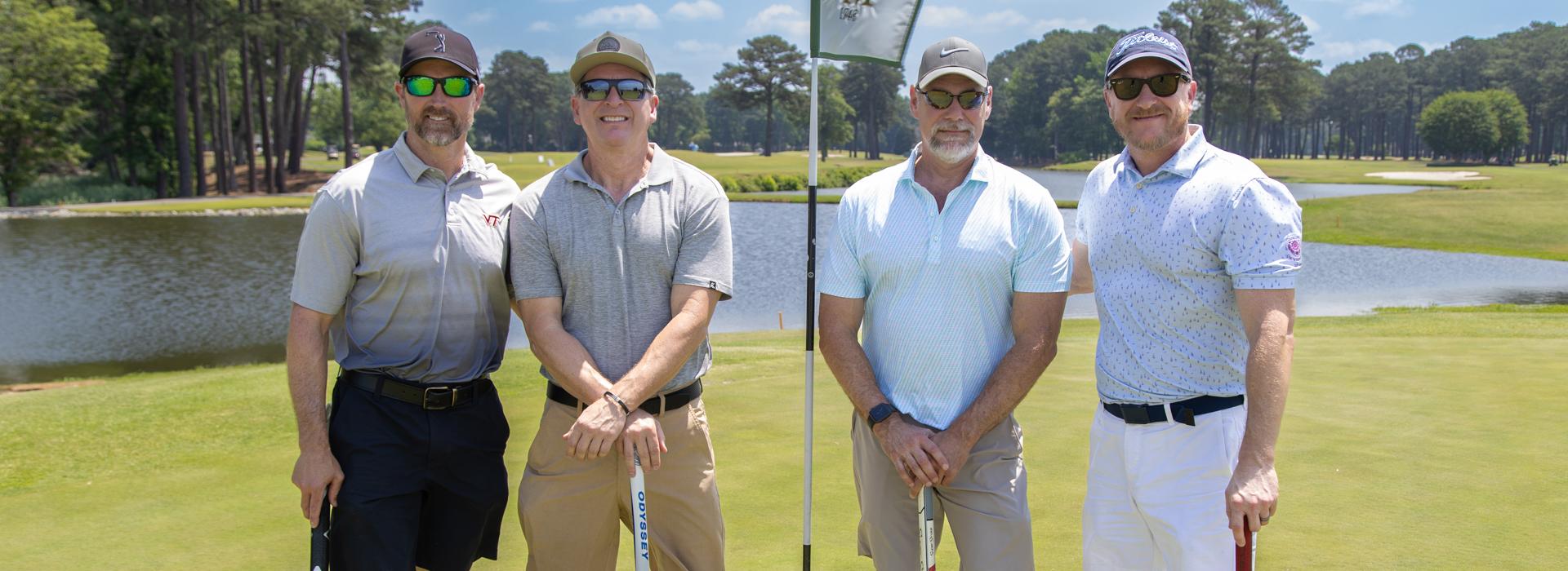 4-man golf team outside on a golf course at the YMCA Charity Golf Classic 2025