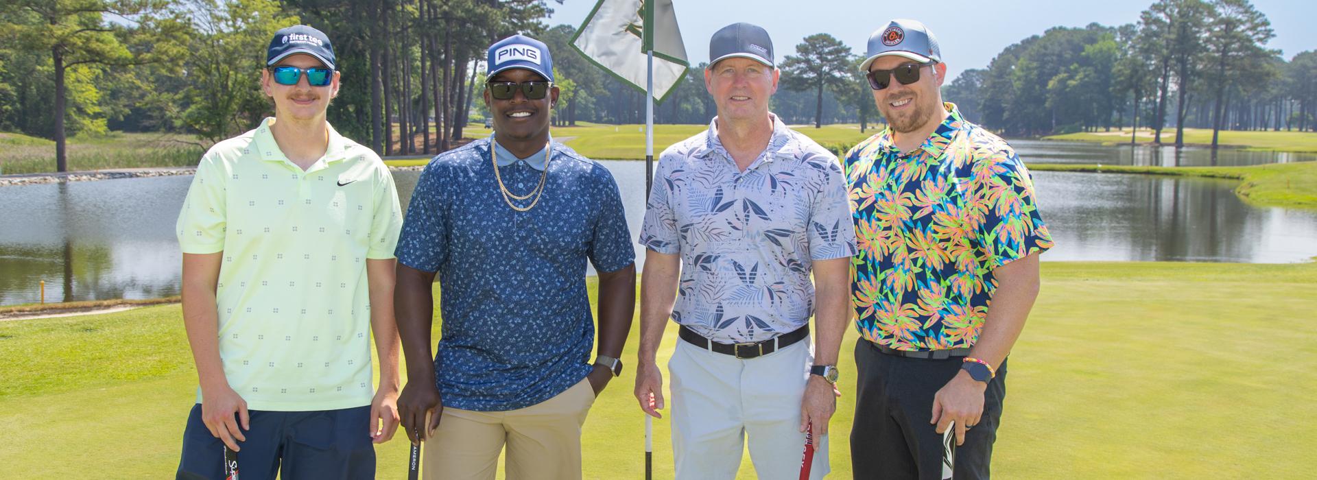 4-man golf team outside on a golf course at the YMCA Charity Golf Classic 2025
