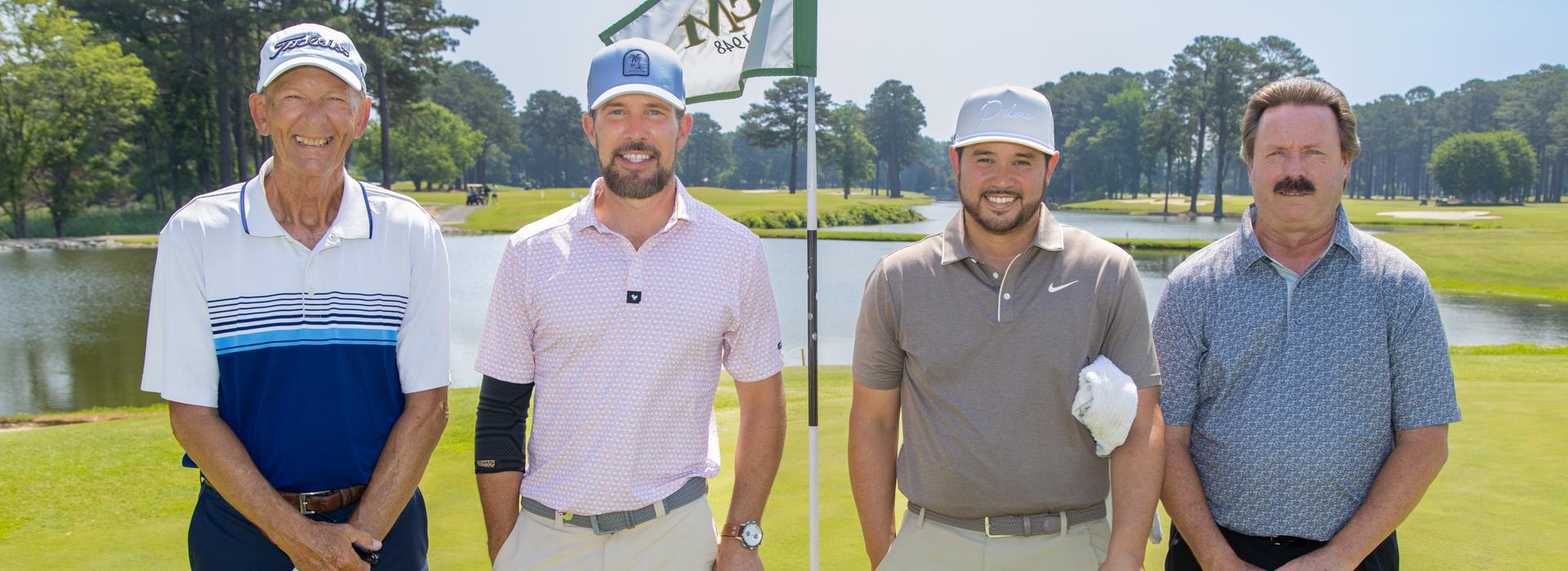 4-man golf team outside on a golf course at the YMCA Charity Golf Classic 2025