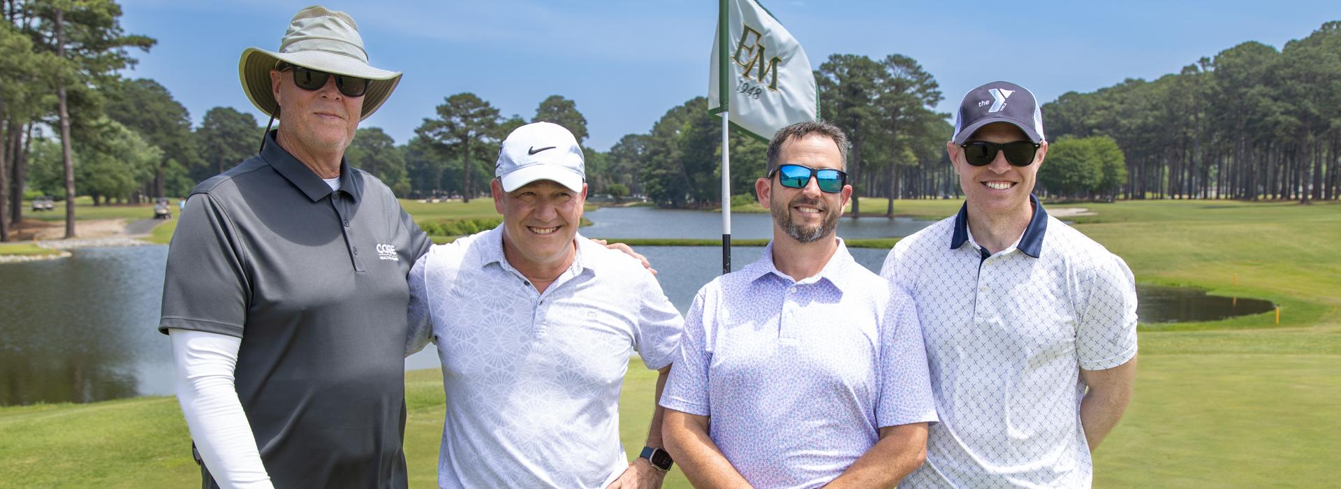 4-man golf team outside on a golf course at the YMCA Charity Golf Classic 2025