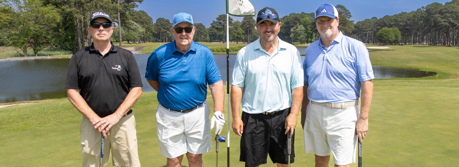 4-man golf team outside on a golf course at the YMCA Charity Golf Classic 2025