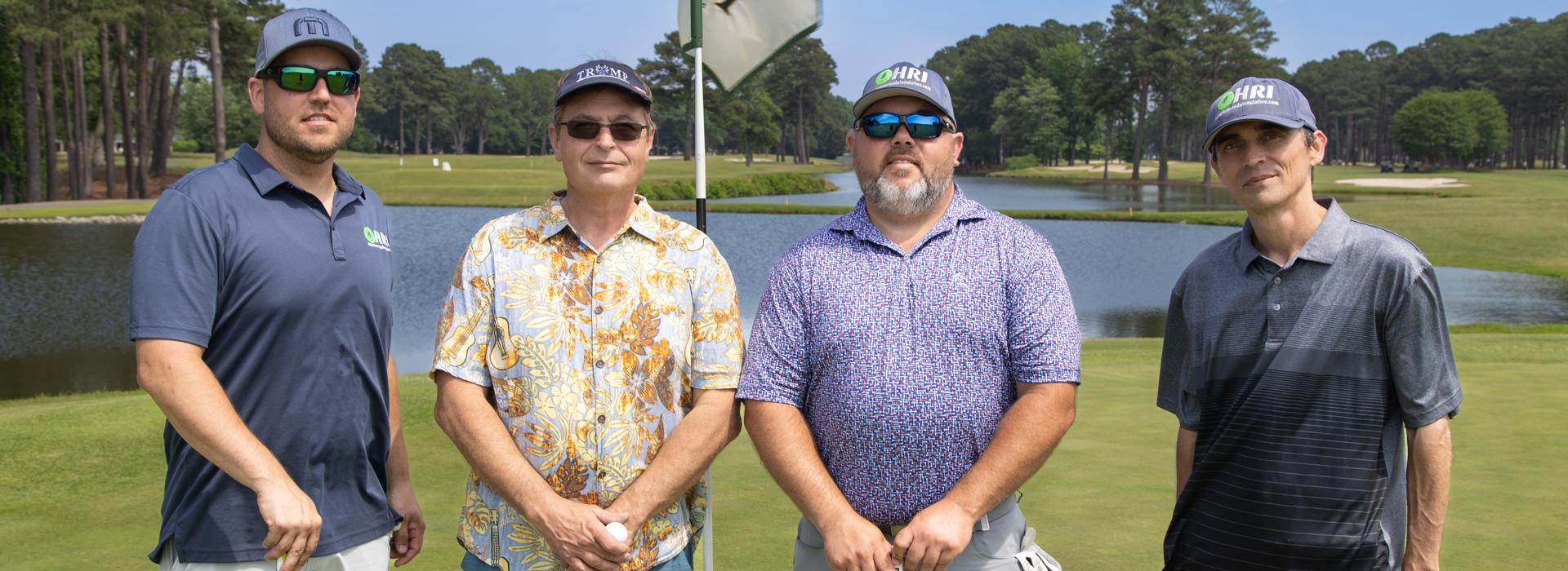 4-man golf team outside on a golf course at the YMCA Charity Golf Classic 2025