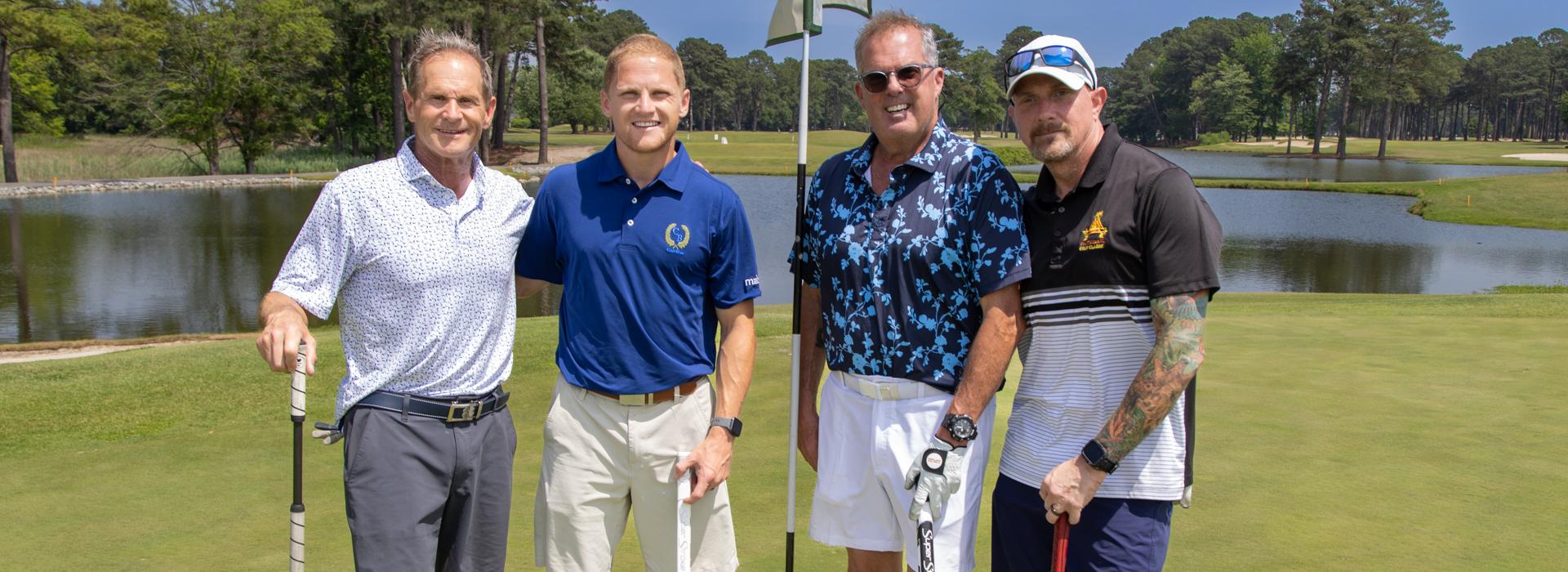 4-man golf team outside on a golf course at the YMCA Charity Golf Classic 2025