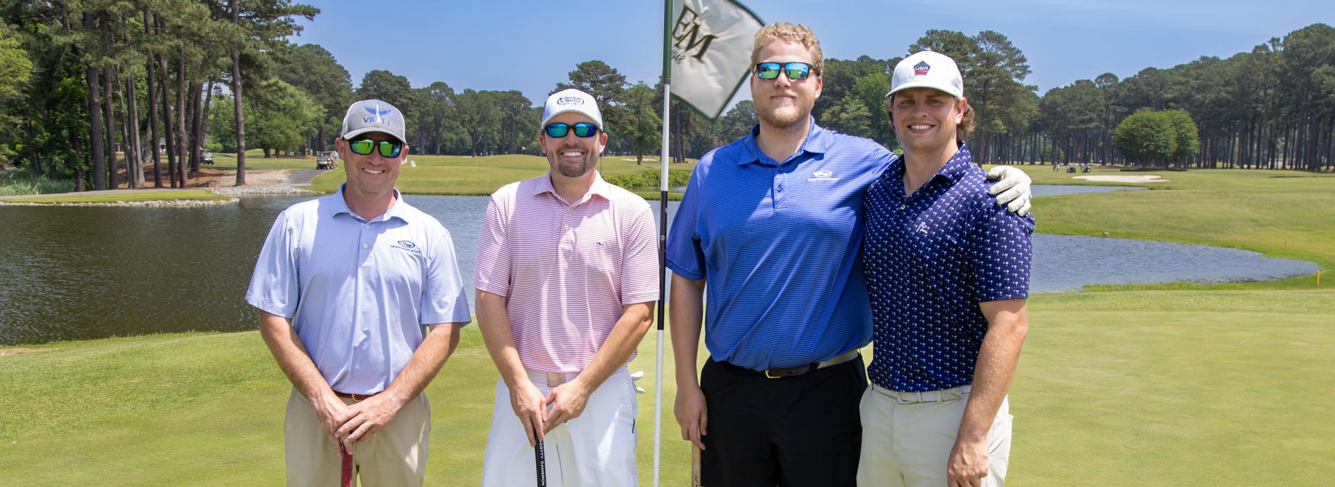 4-man golf team outside on a golf course at the YMCA Charity Golf Classic 2025