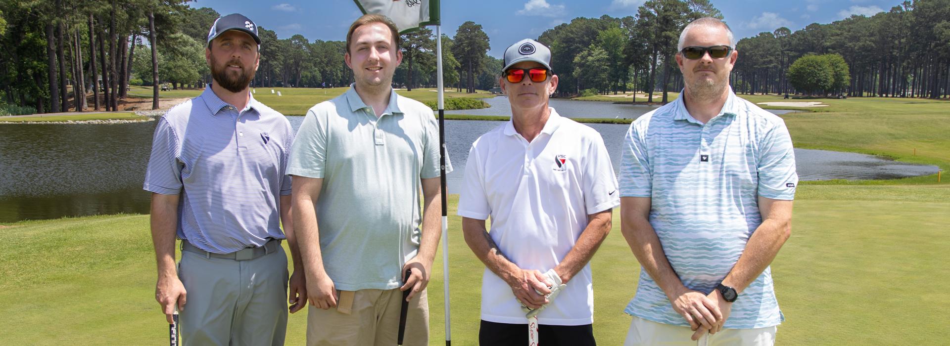 4-man golf team outside on a golf course at the YMCA Charity Golf Classic 2025