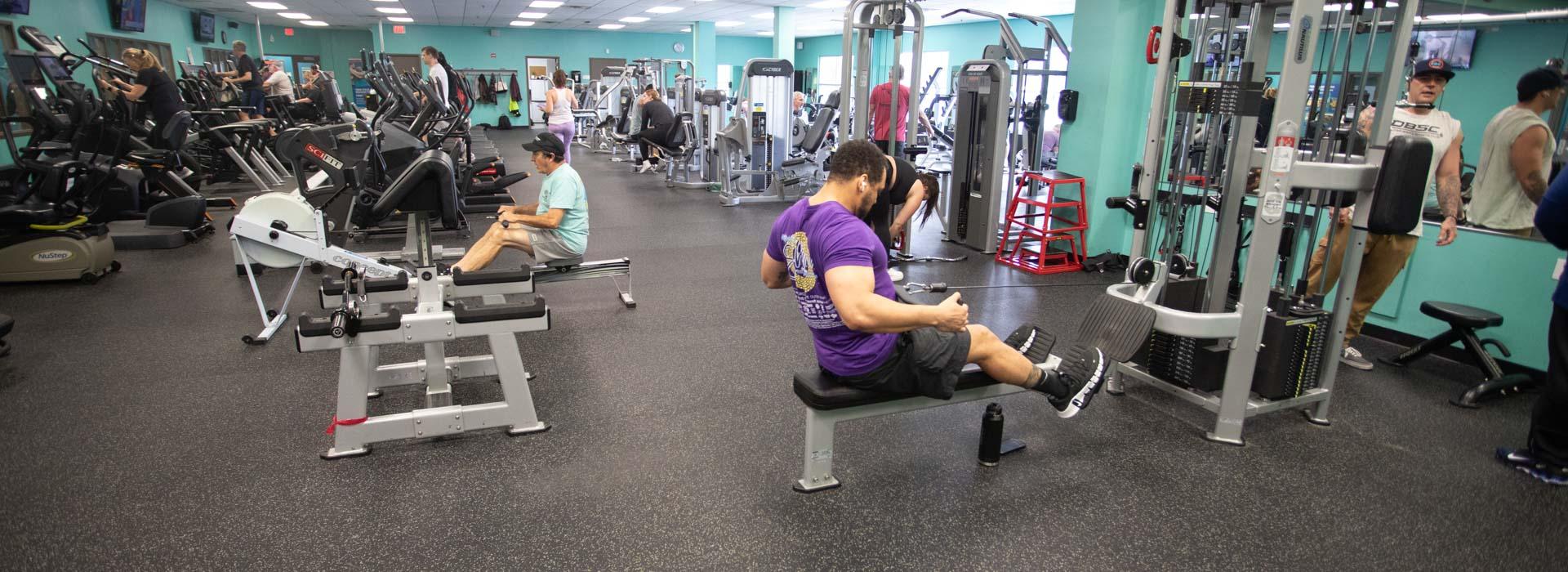 Wellness fitness center with people working out at the Outer Banks Family YMCA