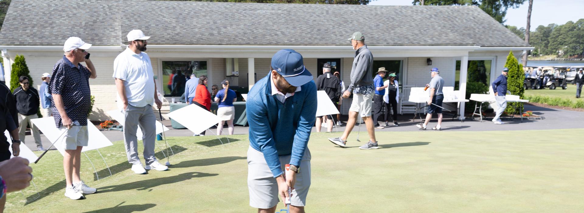 man putting a golf club