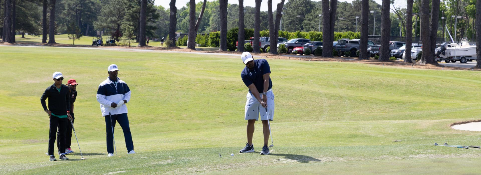 4 men on the golf course