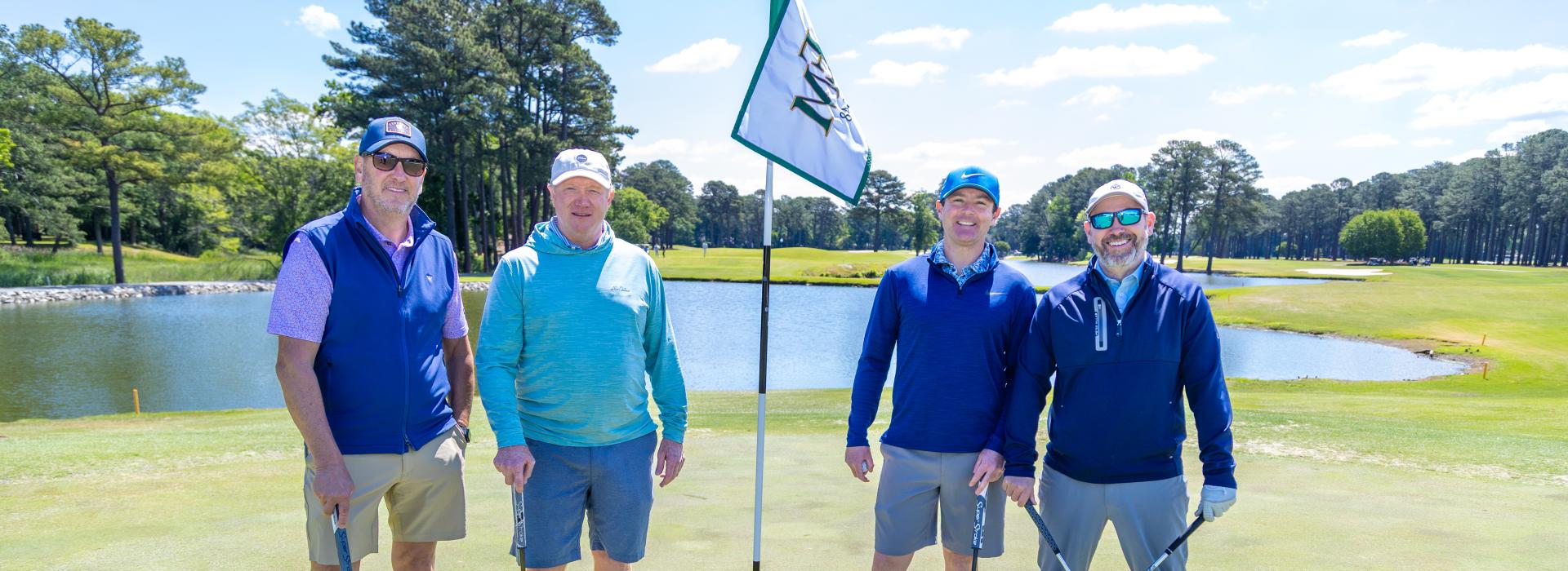 4 men on the golf green