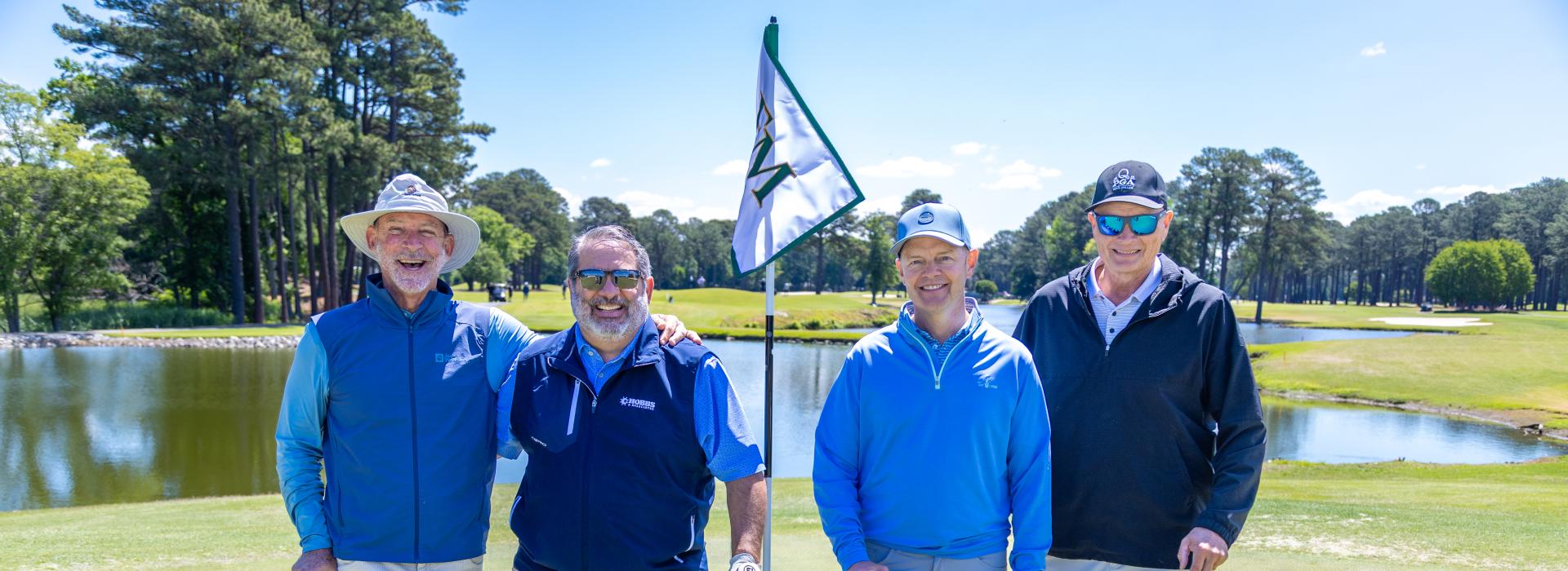 4 men on the golf green