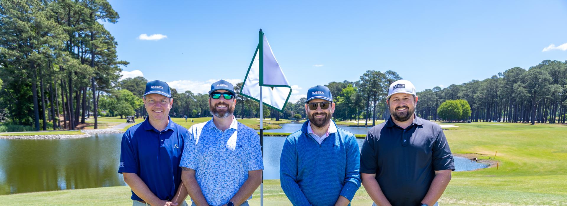4 men on the golf course