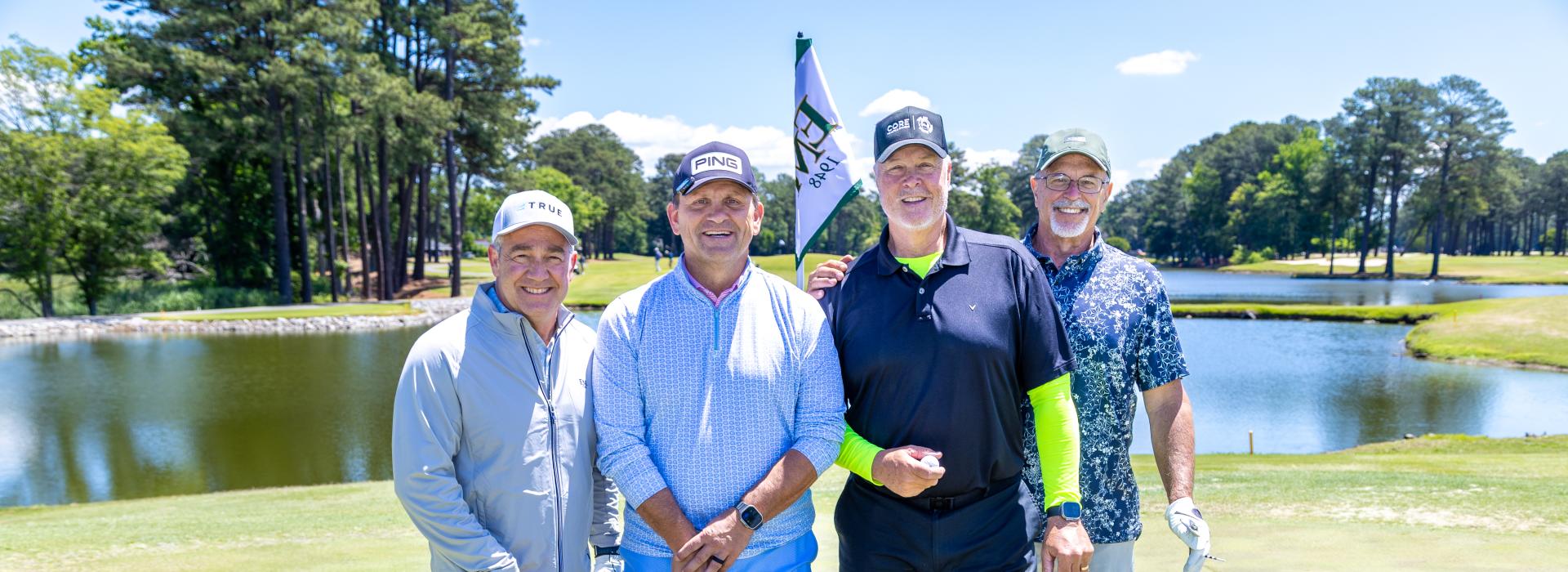 4 men on the golf course