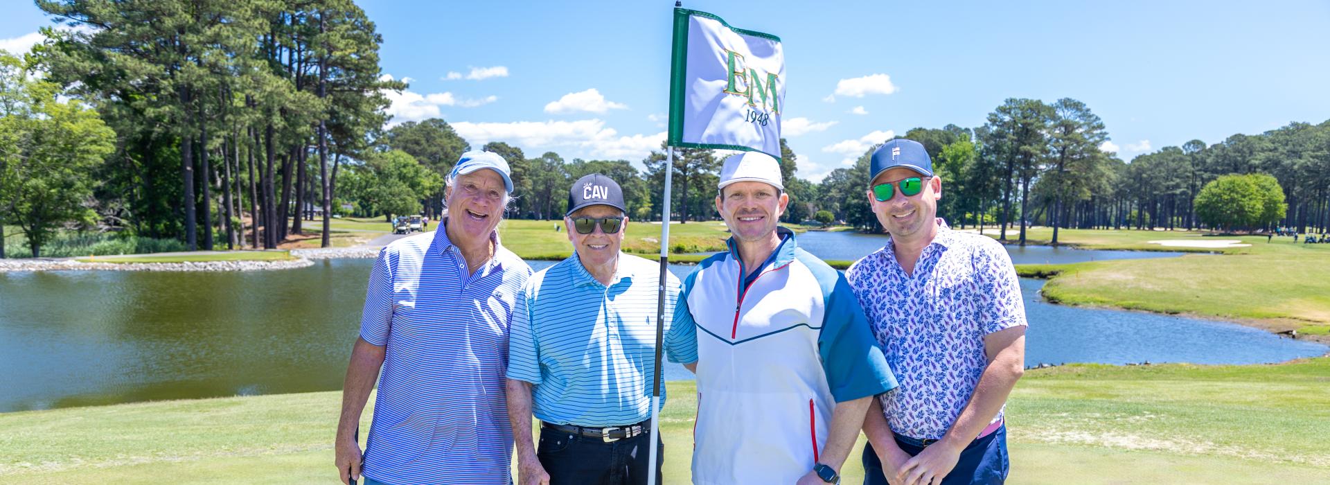 4 men on the golf green