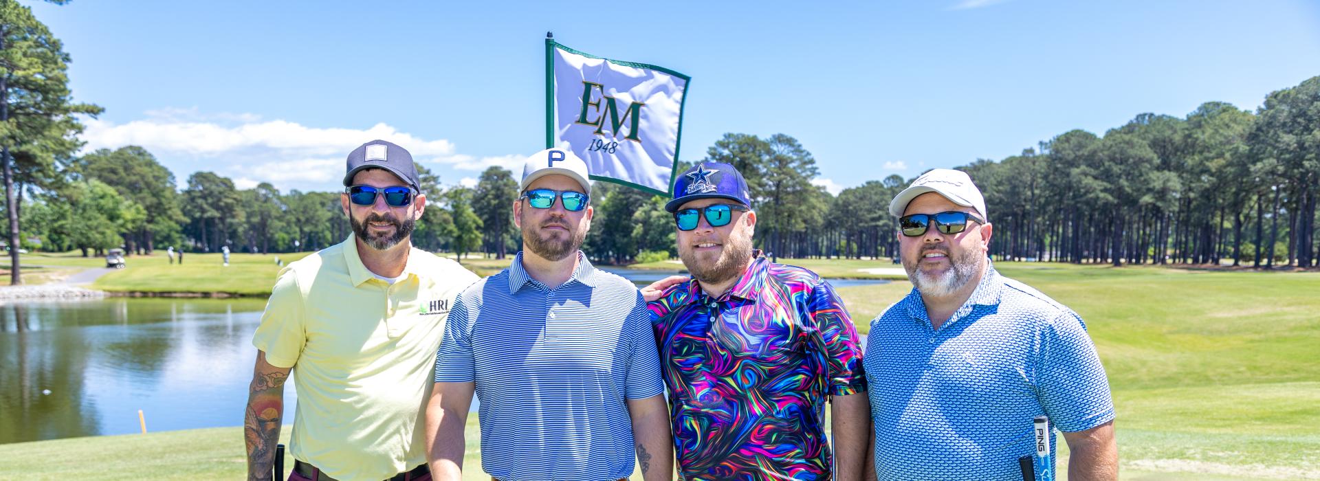 4 men on the golf course