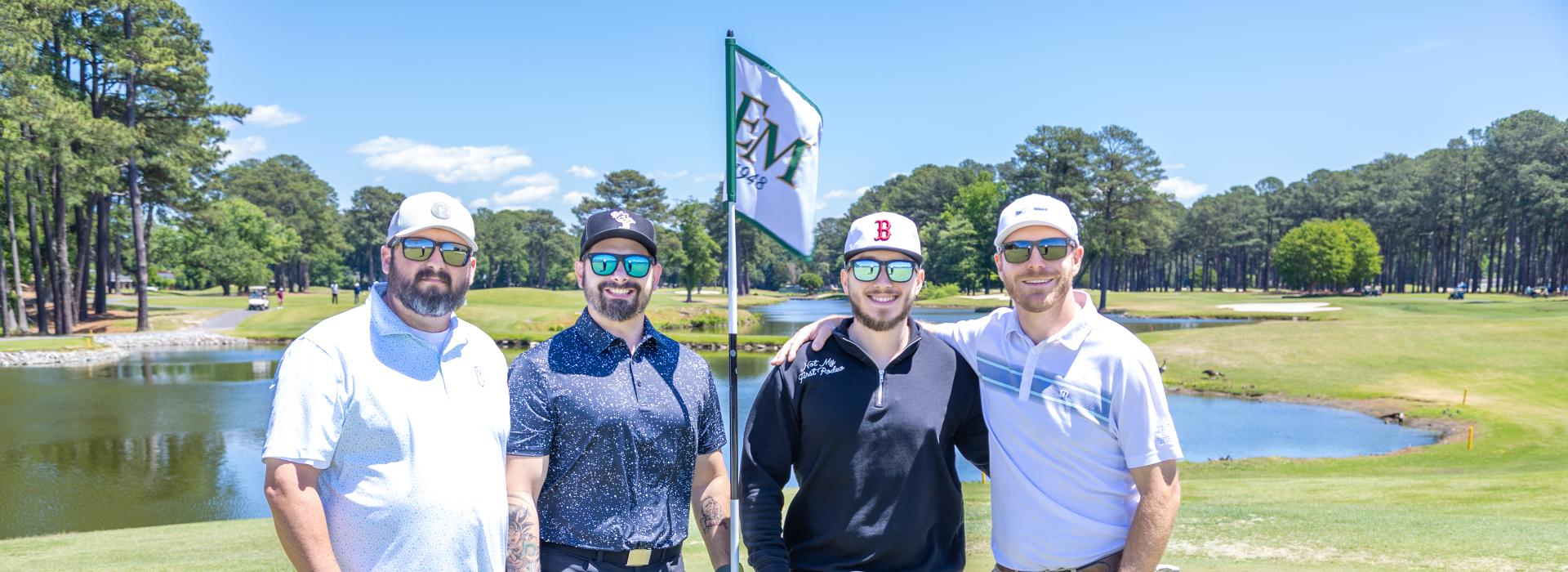 4 men on the golf course