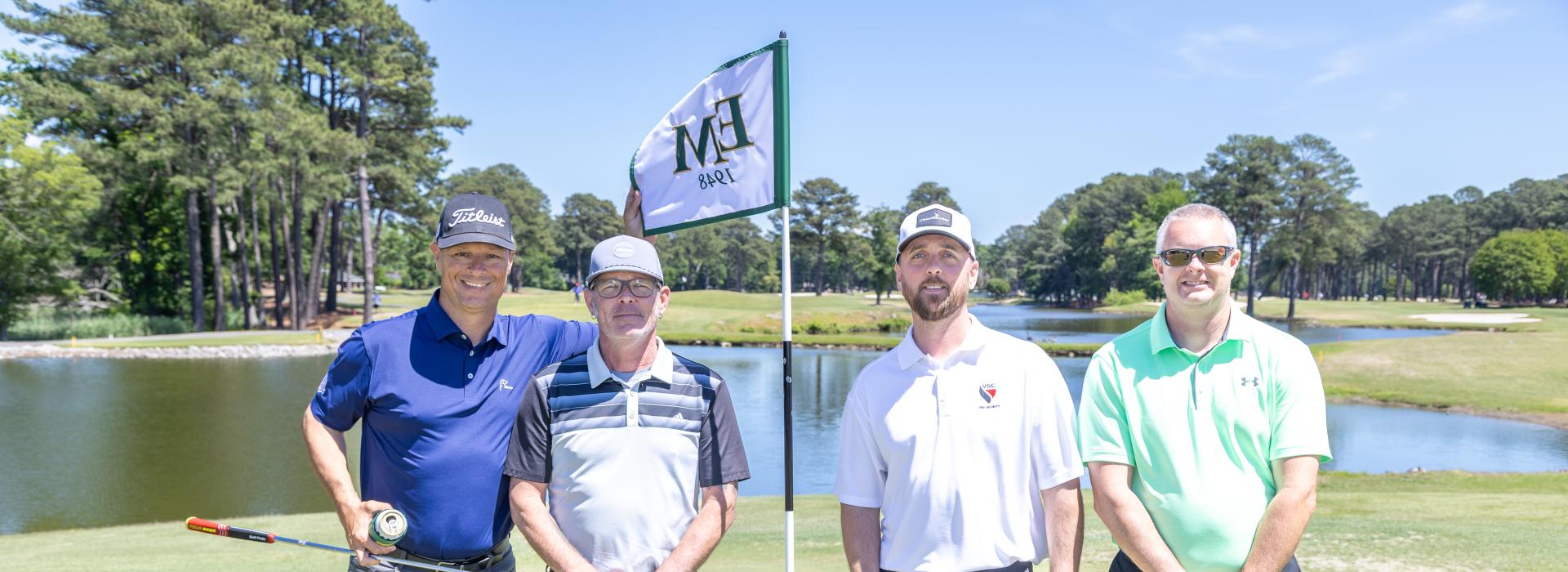 4 guys on a golf course