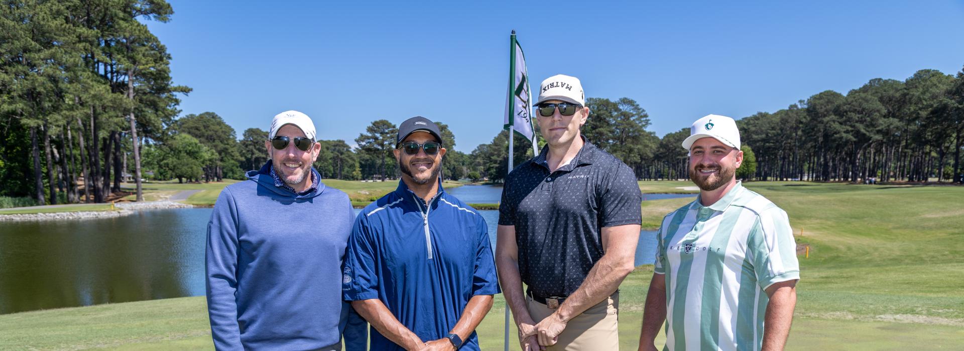 4 men on the golf course