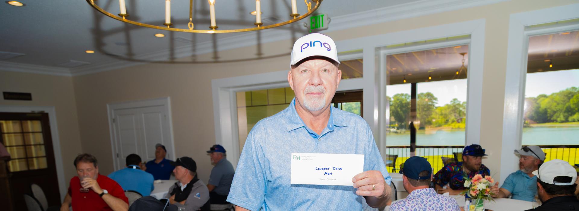 guy holding an envelope