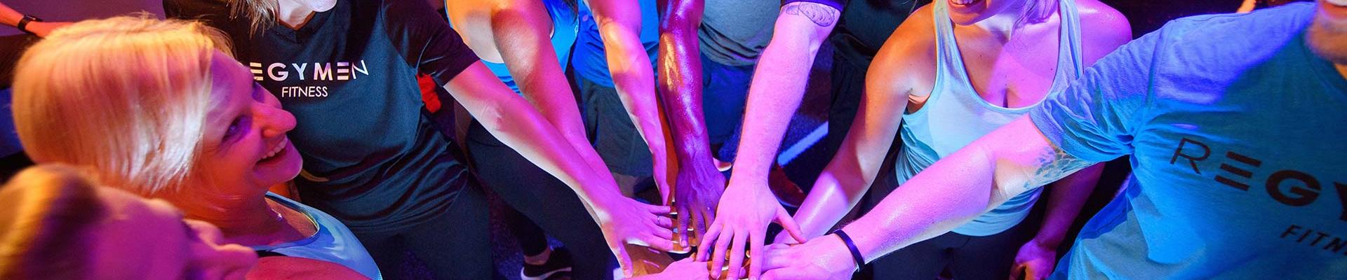 A group of people putting hands in showing team spirit