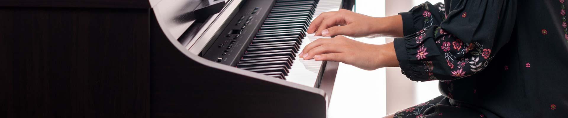 A girl's hands on a piano