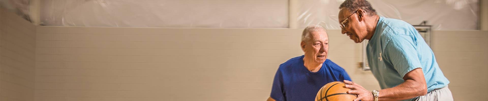 senior men playing basketball