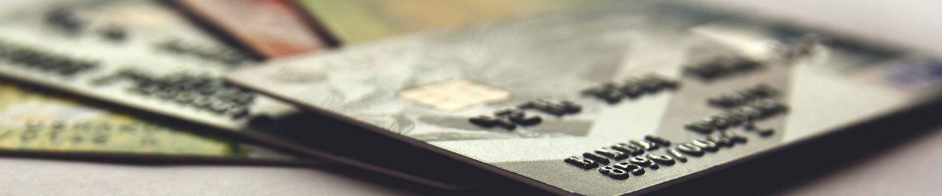 Background image of credit cards laying on a surface