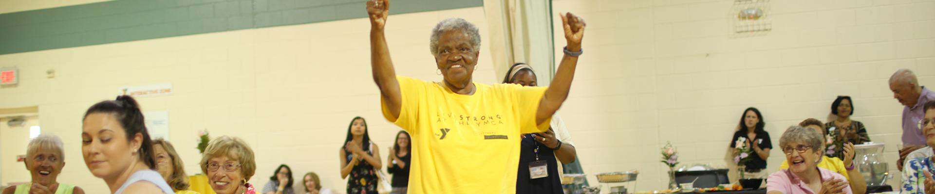 Lady graduating from LIVESTRONG