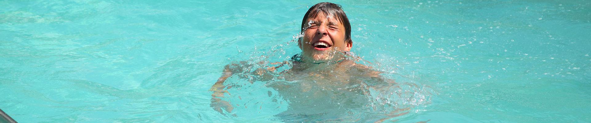 Camper in swimming pool at YMCA Camp Silver Beach