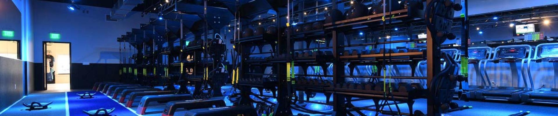 A Regymen fitness studio with weights and treadmills