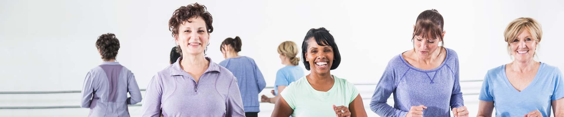 A diverse group of seniors in a fitness studio
