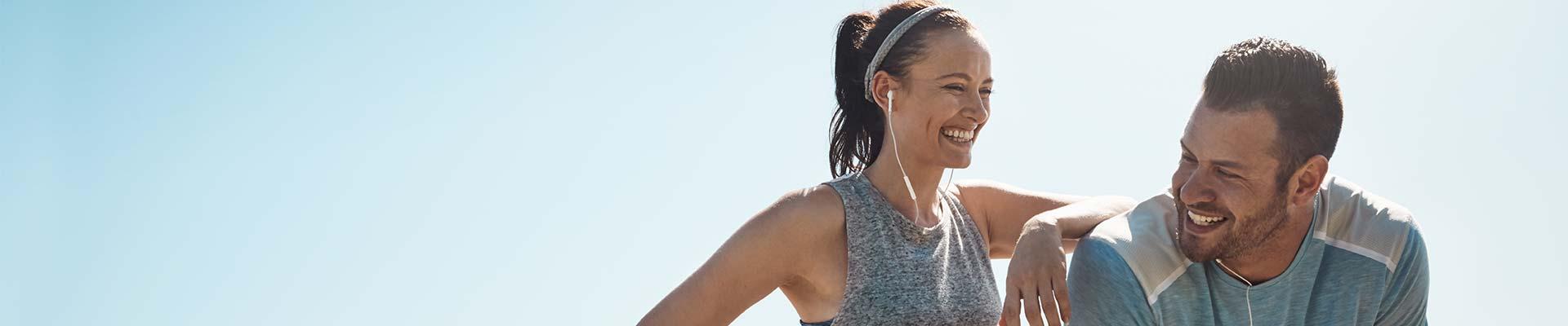 Man and woman smiling after going for a run