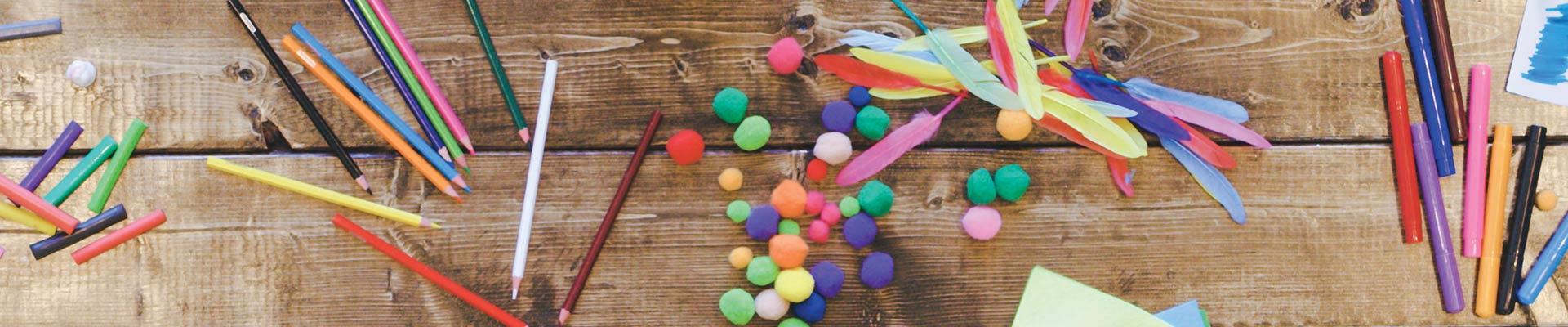 Art supplies scattered on a table top