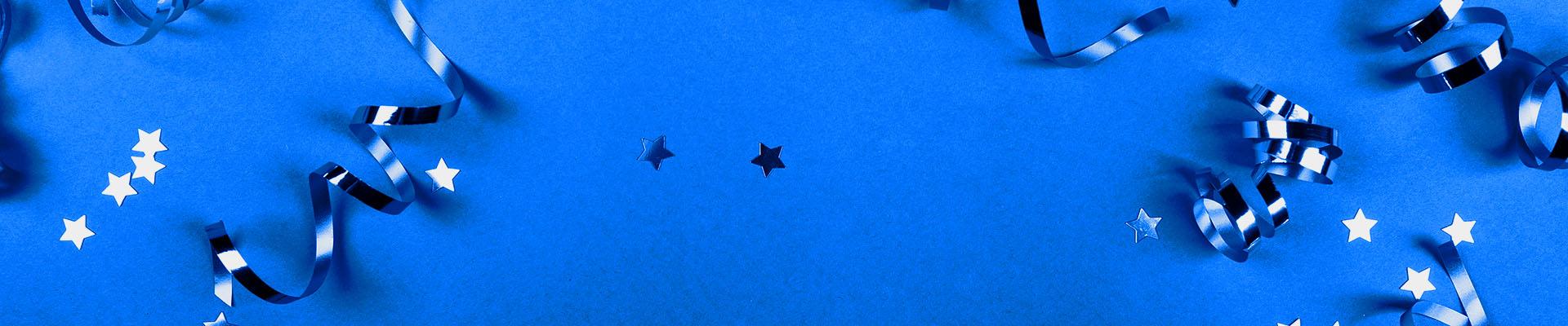Blue texture with curling ribbon and star-shaped glitter confetti