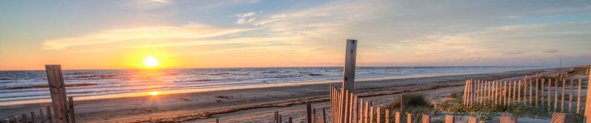 Sunset rising over the Atlantic ocean and beach