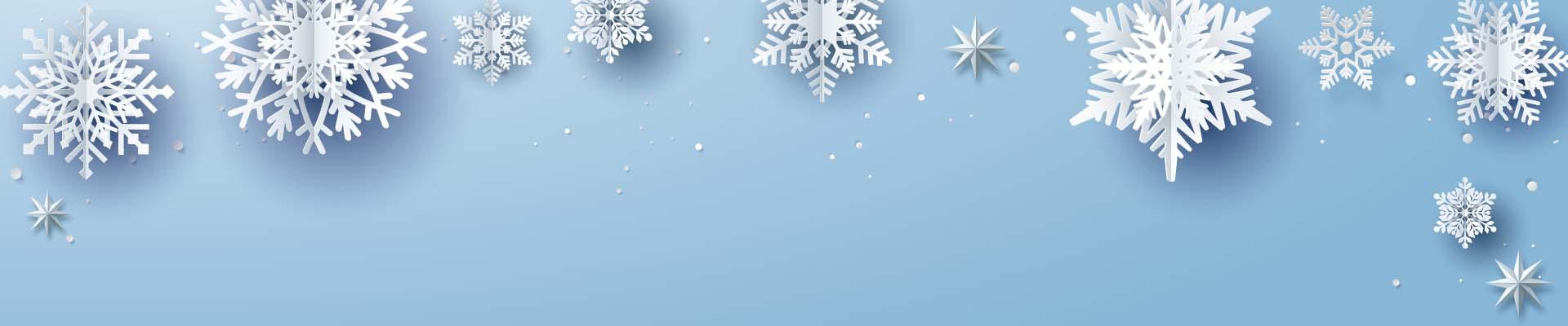 Blue background with white paper snowflakes