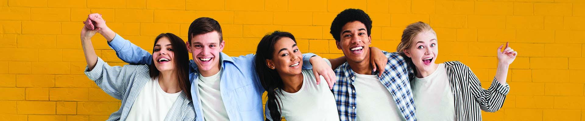 Sponsor A Teen banner with teens with their arms around each other smiling with a yellow background