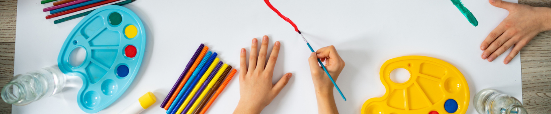 Little kids hands doing arts and crafts