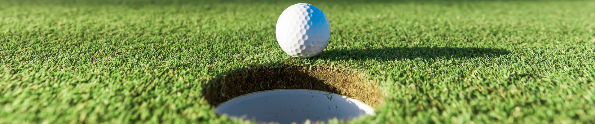 Golf player making a successful stroke