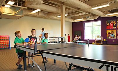 children in Izone playing Ping Pong