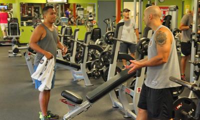 men working on in the weight room