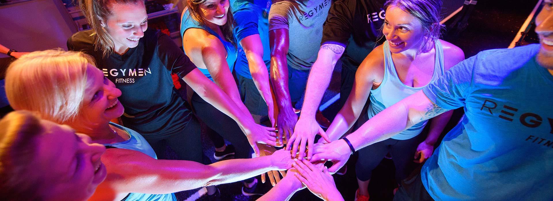 A group of people putting hands in showing team spirit