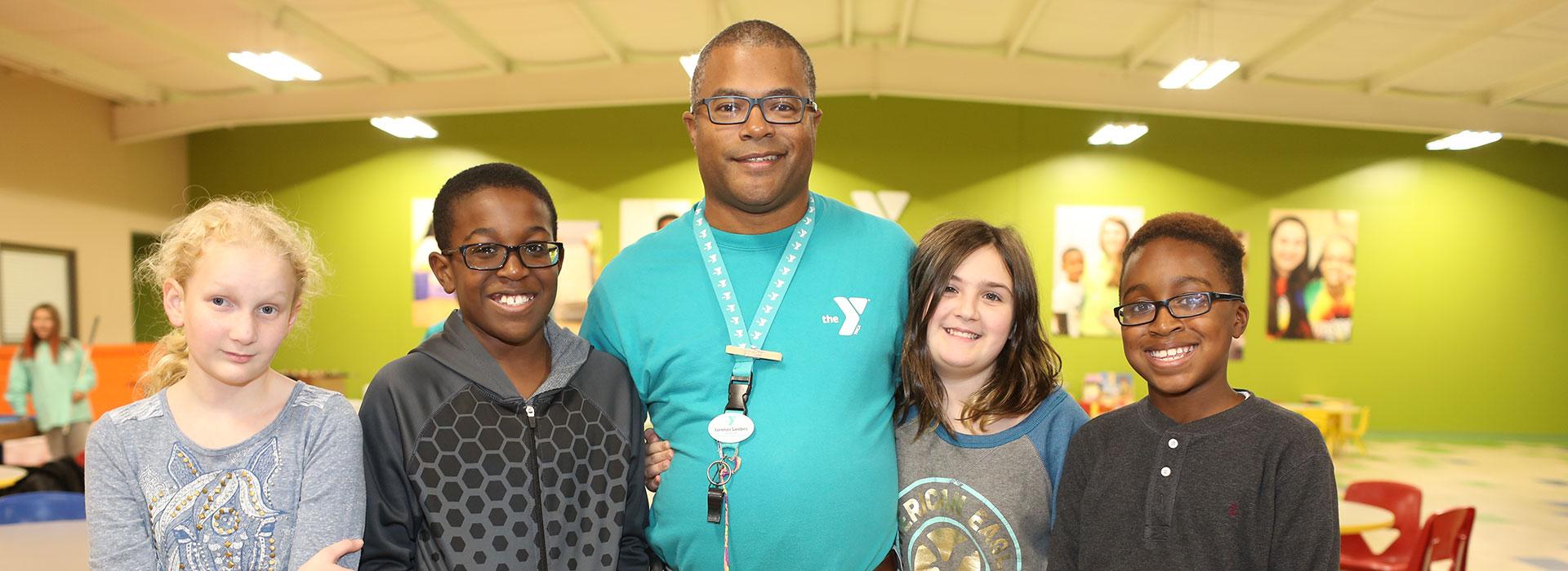 YMCA child care staff member with middle school after-school teens at the Suffolk Family YMCA