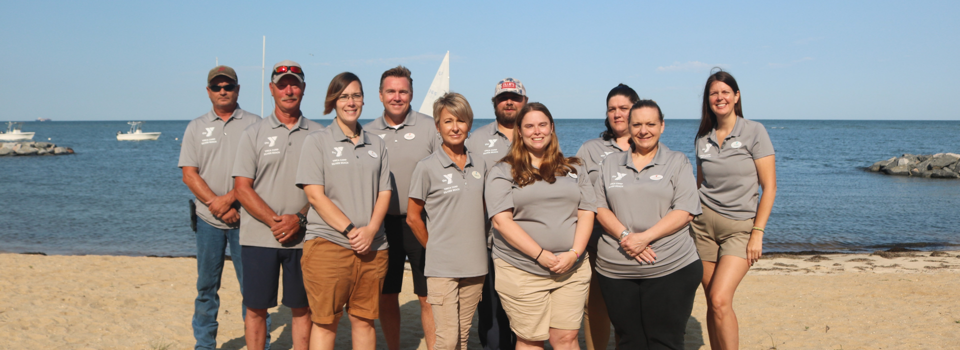 YMCA Camp Silver Beach staff on the beach