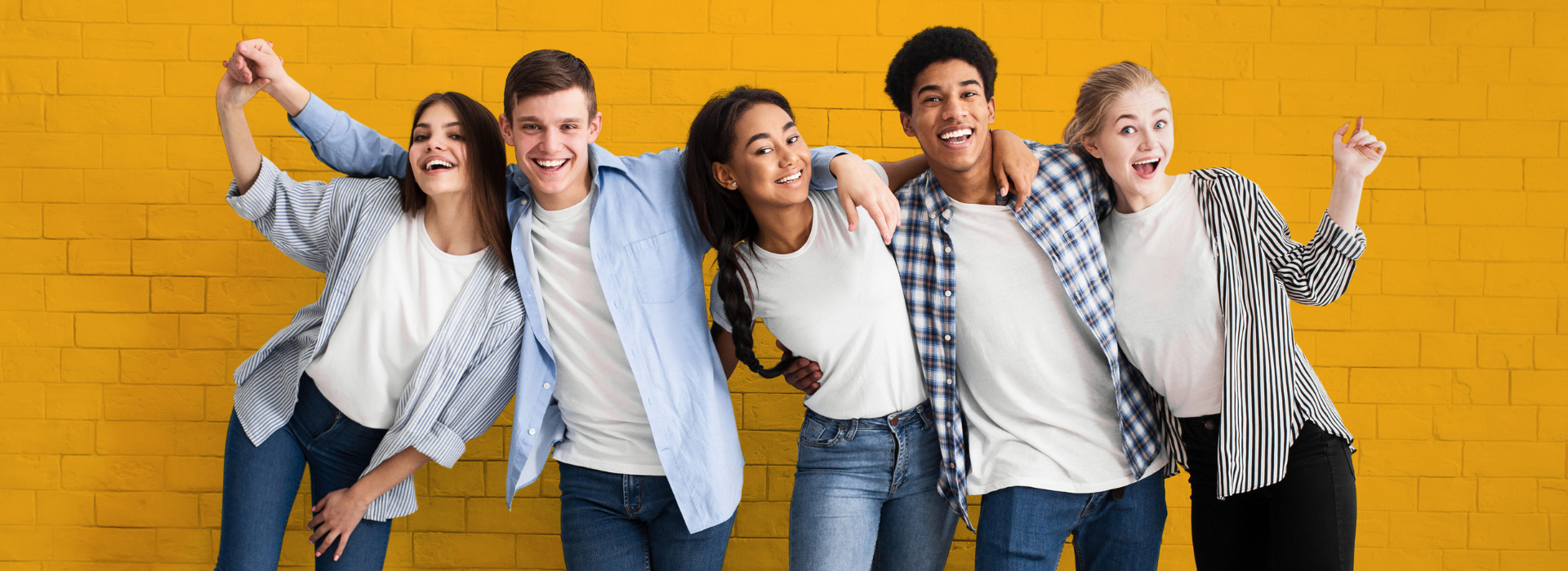 Teens against a yellow brick wall for the 2024 Sponsor A Teen membership