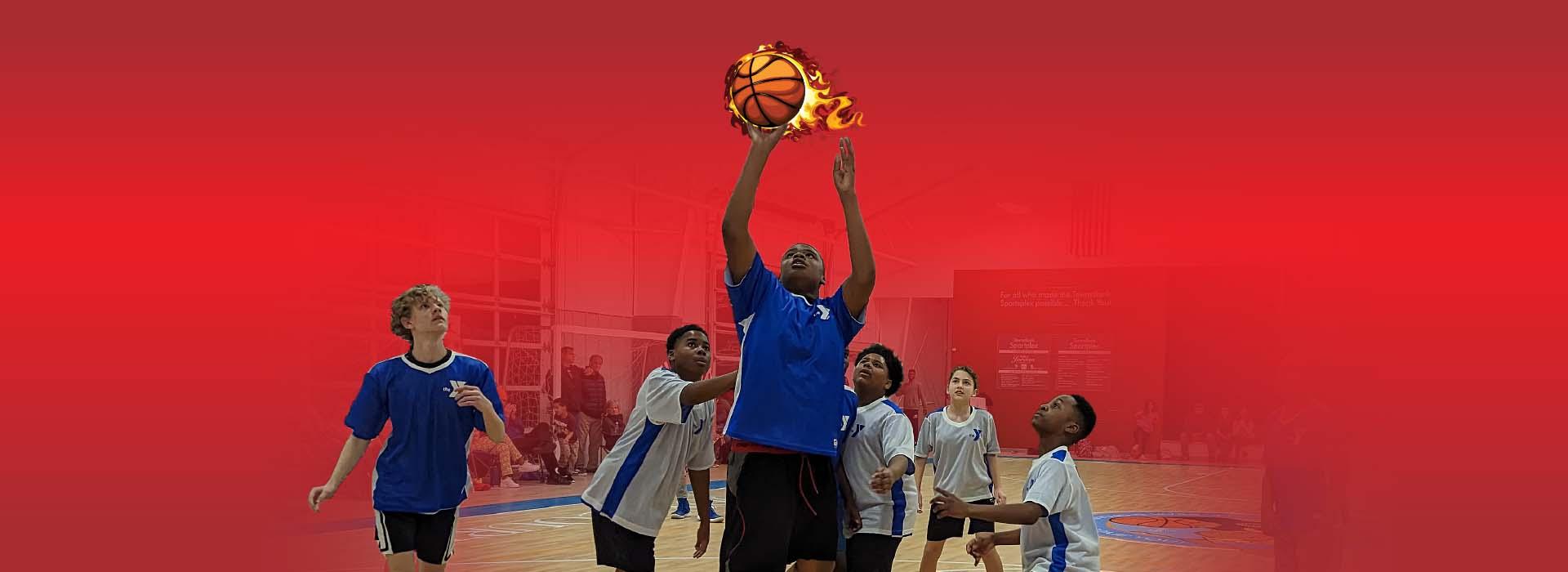 Youth basketball players look on while their coach shoots a basket